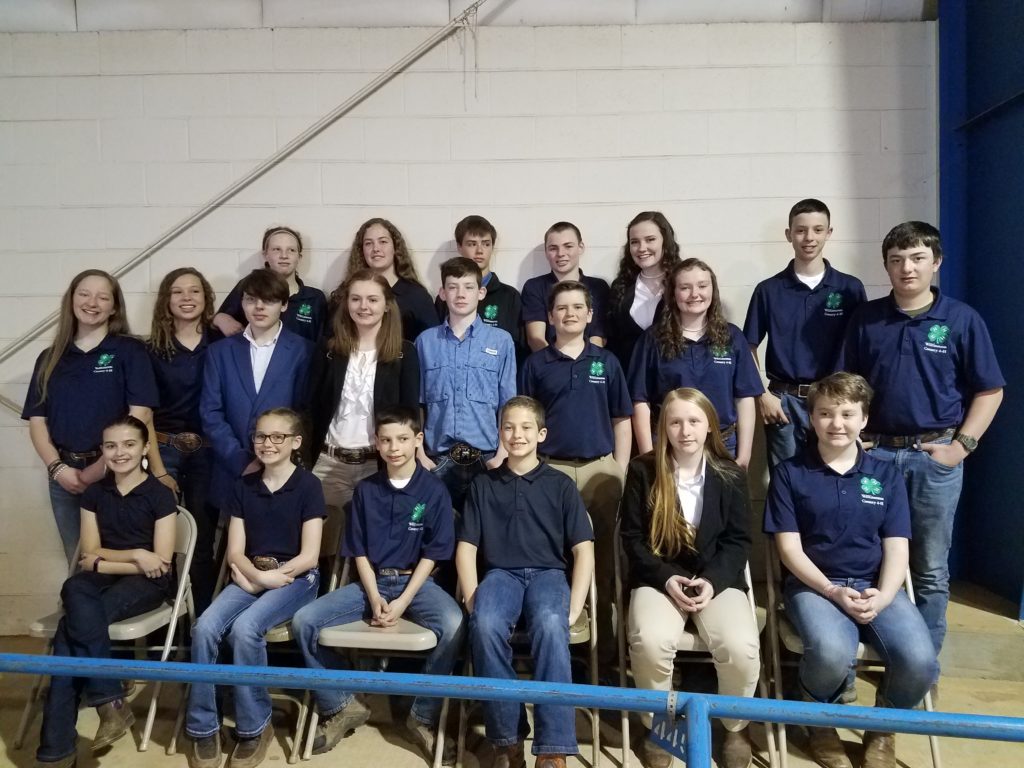 4-H livestock judging team members in 4-H polo shirts