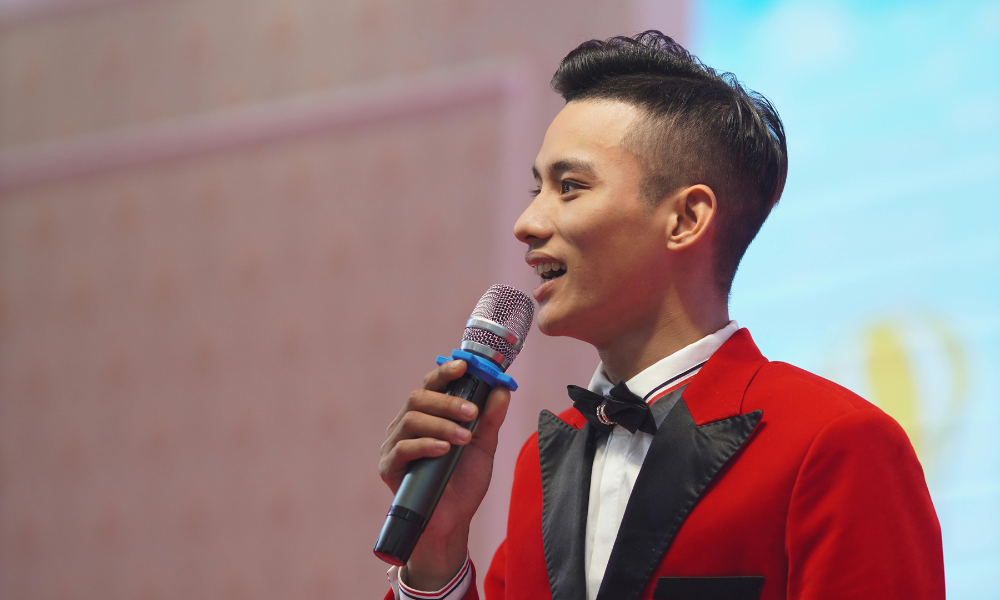 young man delivering a public speech